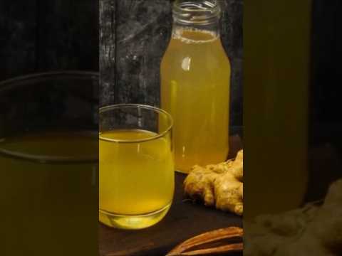 Glass of natural detox drink for weight loss and belly fat reduction