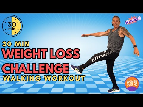 Woman doing a 30-minute weight loss walking workout at home