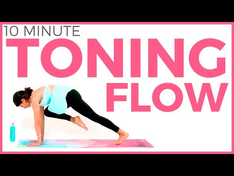 Yoga for Weight Loss & TONING | 10 minute Power Yoga Workout 33 A woman performing power yoga at home during a 10-minute workout for weight loss and body toning.