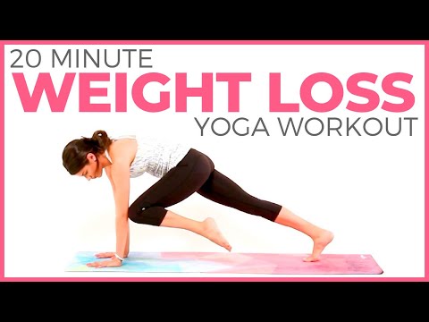 Person doing a 20-minute fat-burning yoga workout for weight loss on a yoga mat.