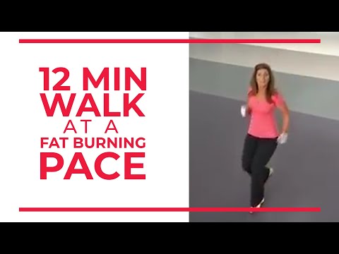 Person walking indoors at a steady fat burning pace for home workout and weight loss