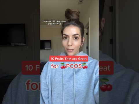 PCOS-friendly fruits including berries, apples, pears, citrus fruits, and pomegranate displayed on a table