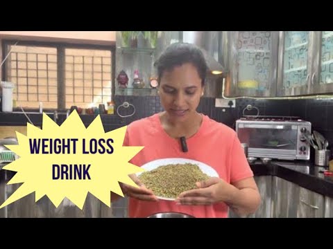 Glass of natural weight loss drink made with lemon, water, and healthy ingredients for fat burning