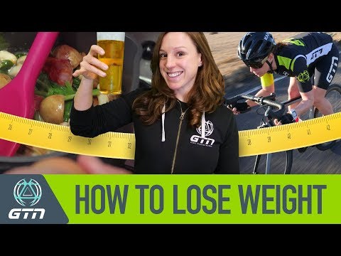 Triathlete running, cycling, and swimming during training for weight loss and endurance